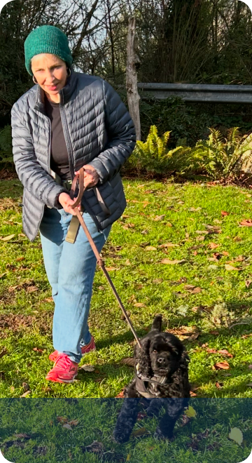 Person with dog in yard